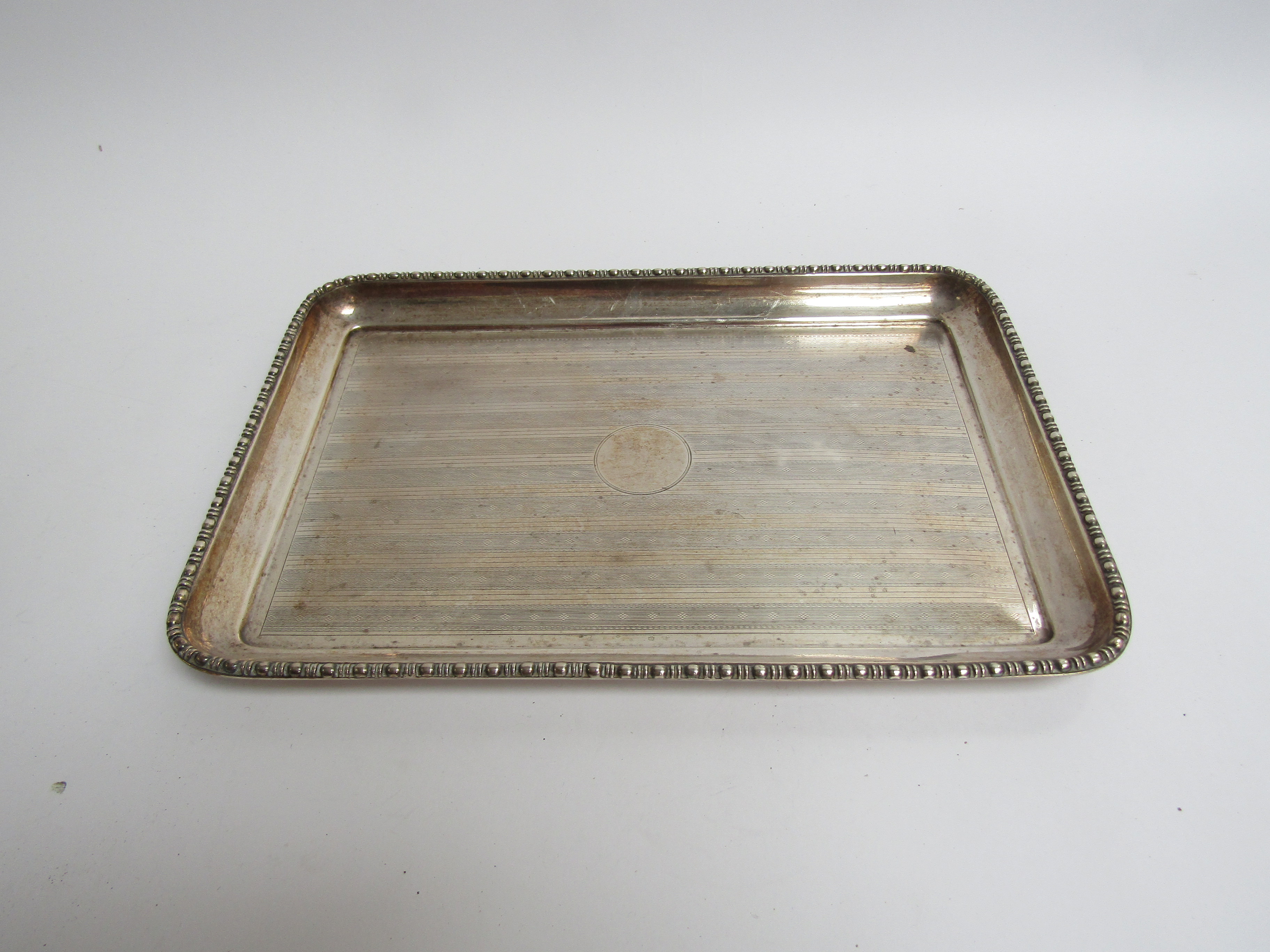 A Levi & Salaman silver tray with vacant central cartouche, engine turned detail, bobbin border,