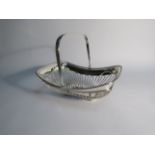 An Edwardian Barker Brothers silver swing handled bread/cake basket, Chester 1908, 23.