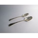 A pair of Georgian silver embossed serving spoons with floral detail, London 1804,