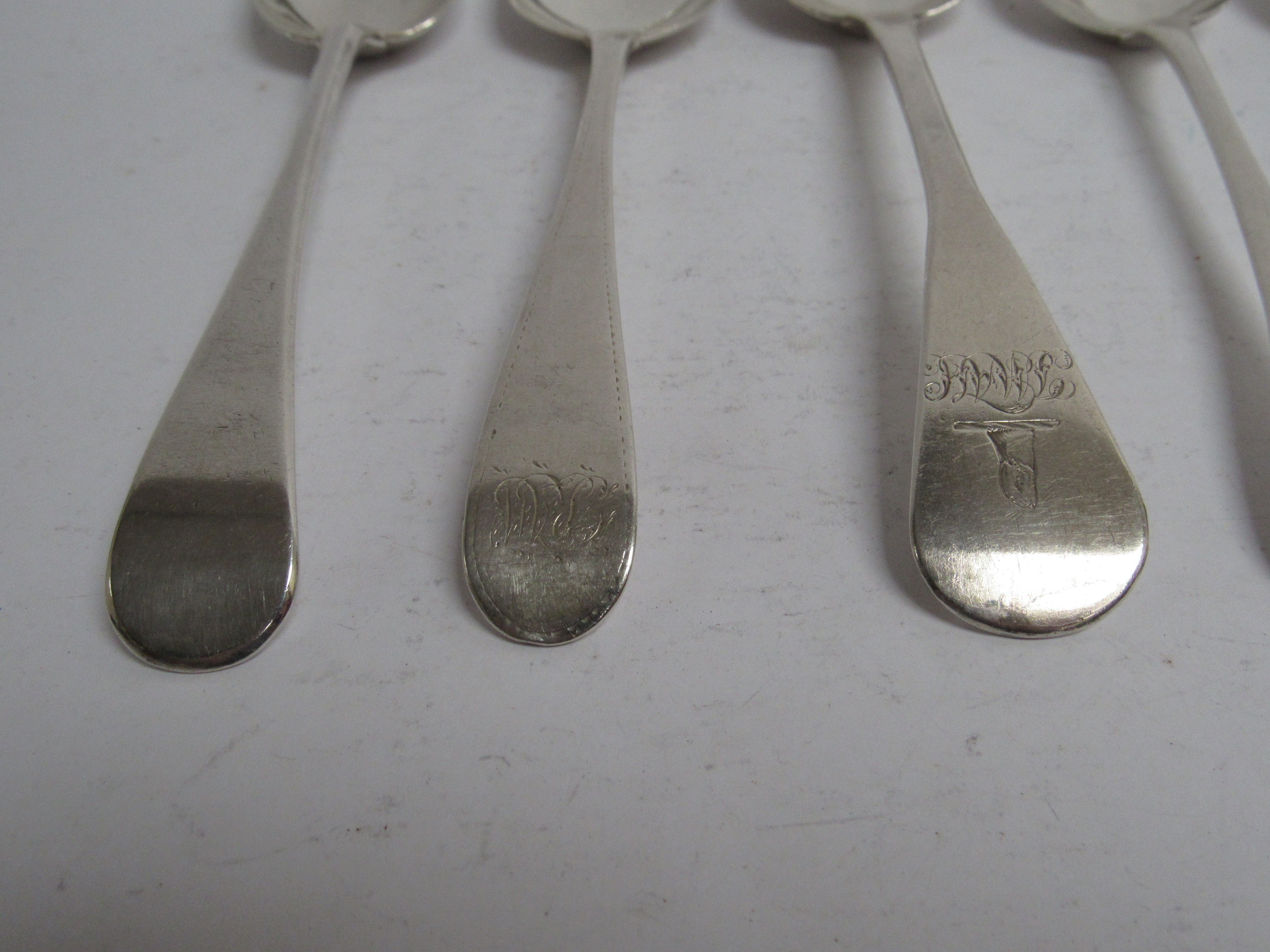 Six various Georgian serving spoons, five with monogrammed handles, - Image 2 of 5