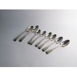 A set of six silver Georgian teaspoons amd two dessert spoons all with monogrammed handles 216g