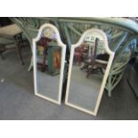 A pair of arch top painted mirrors,