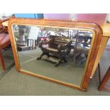 A walnut arch framed overmantel mirror,