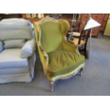 A 19th Century gilt and gesso carved framed French armchair with green velour upholstery,