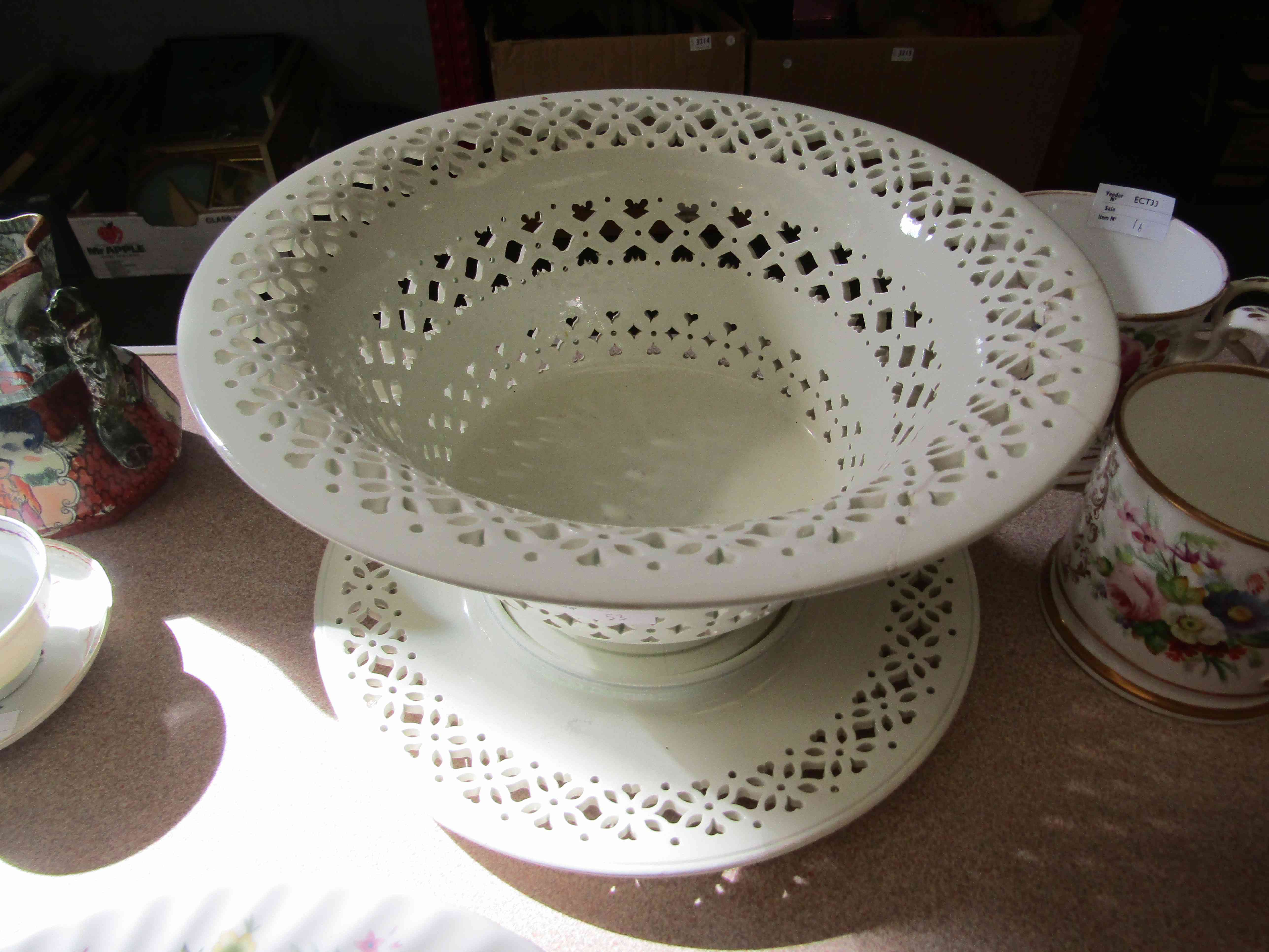 A large pierced creamware fruit basket and stand, 17cm tall,