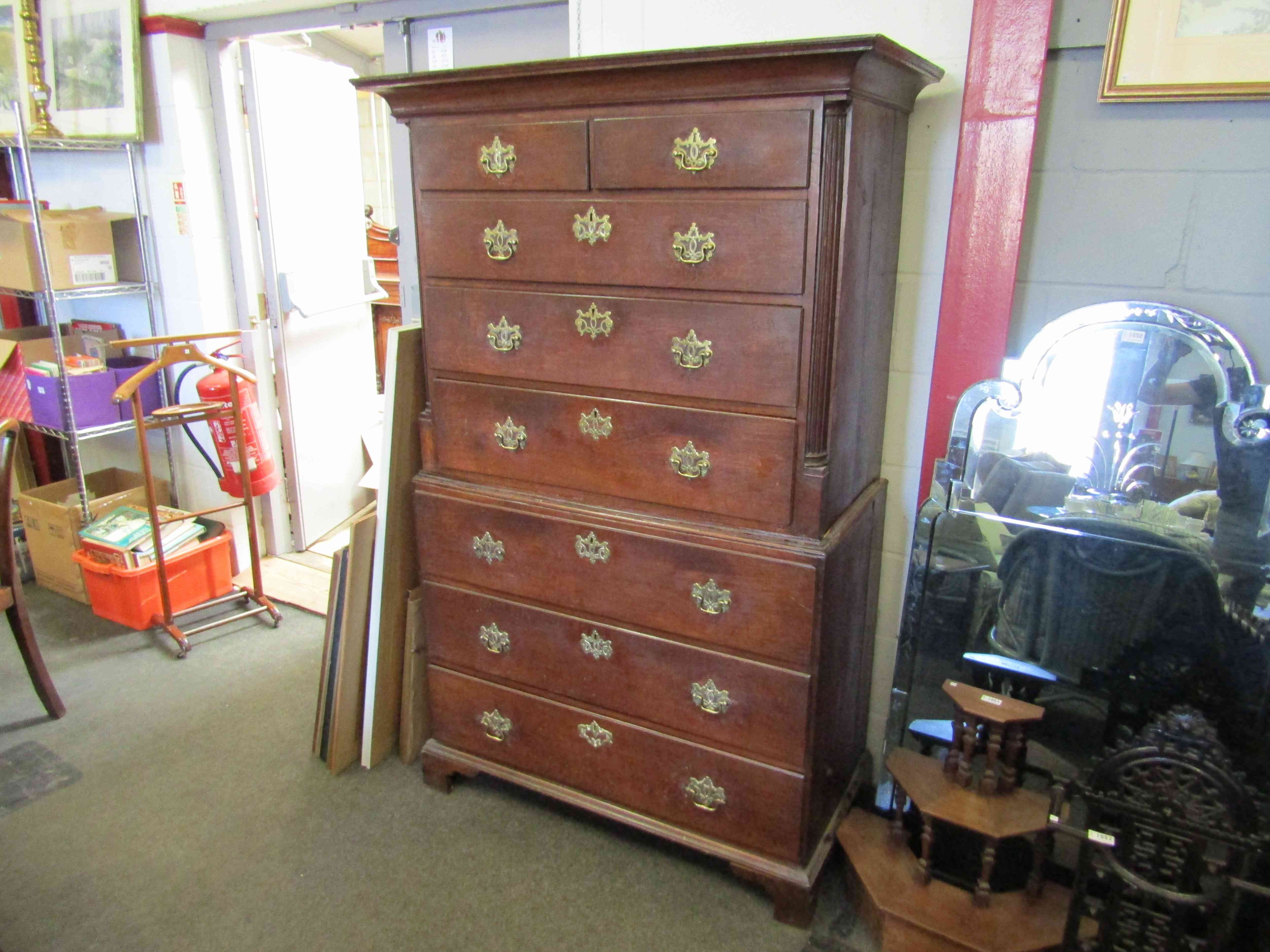 A Georgian chest on chest, two over three drawer top on three drawer base,