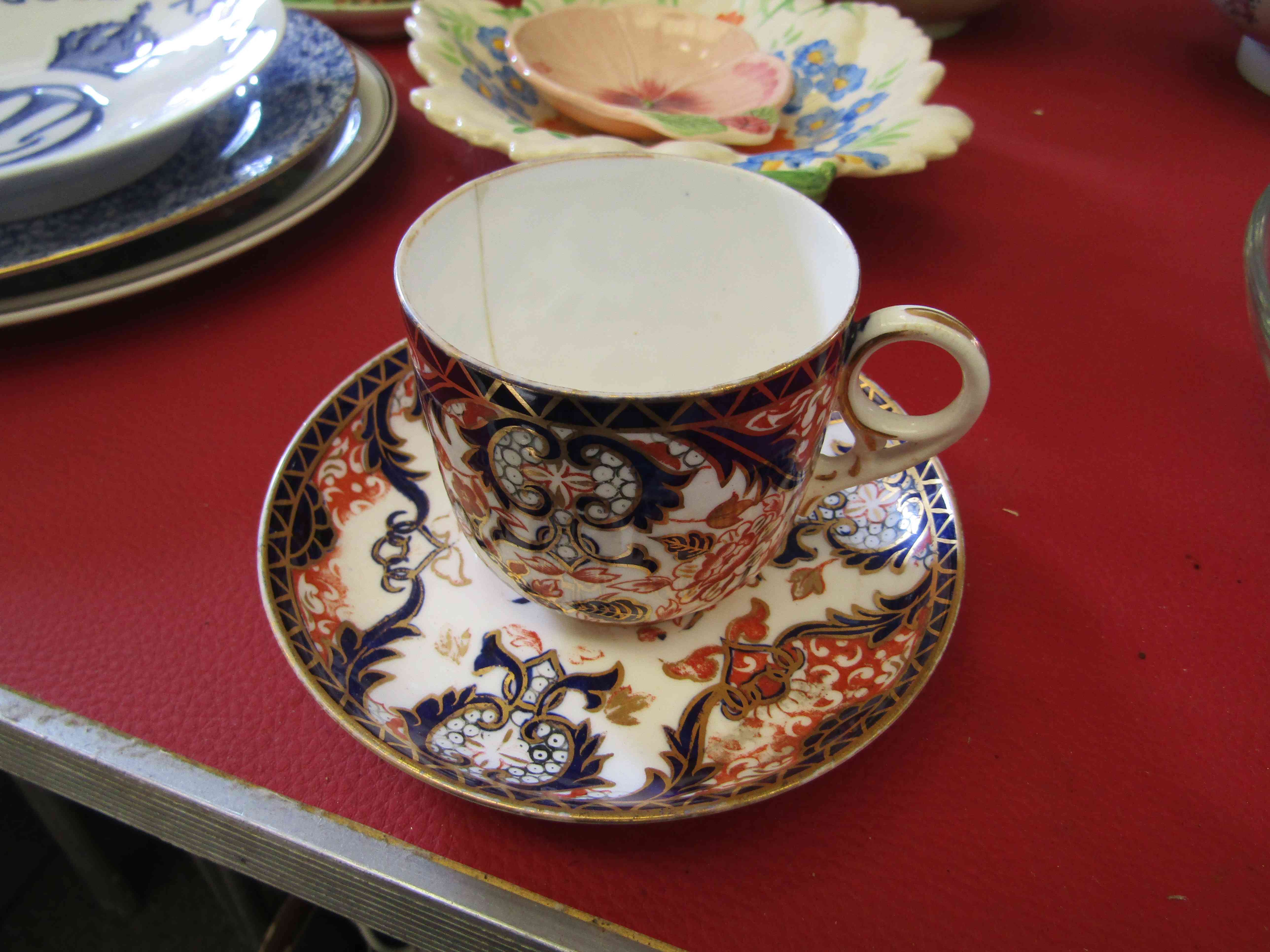 A Derby Imari pattern tea cup and saucer,