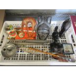 A tray of miscellaneous including carved African busts, shoe horns, pewter candlestick,
