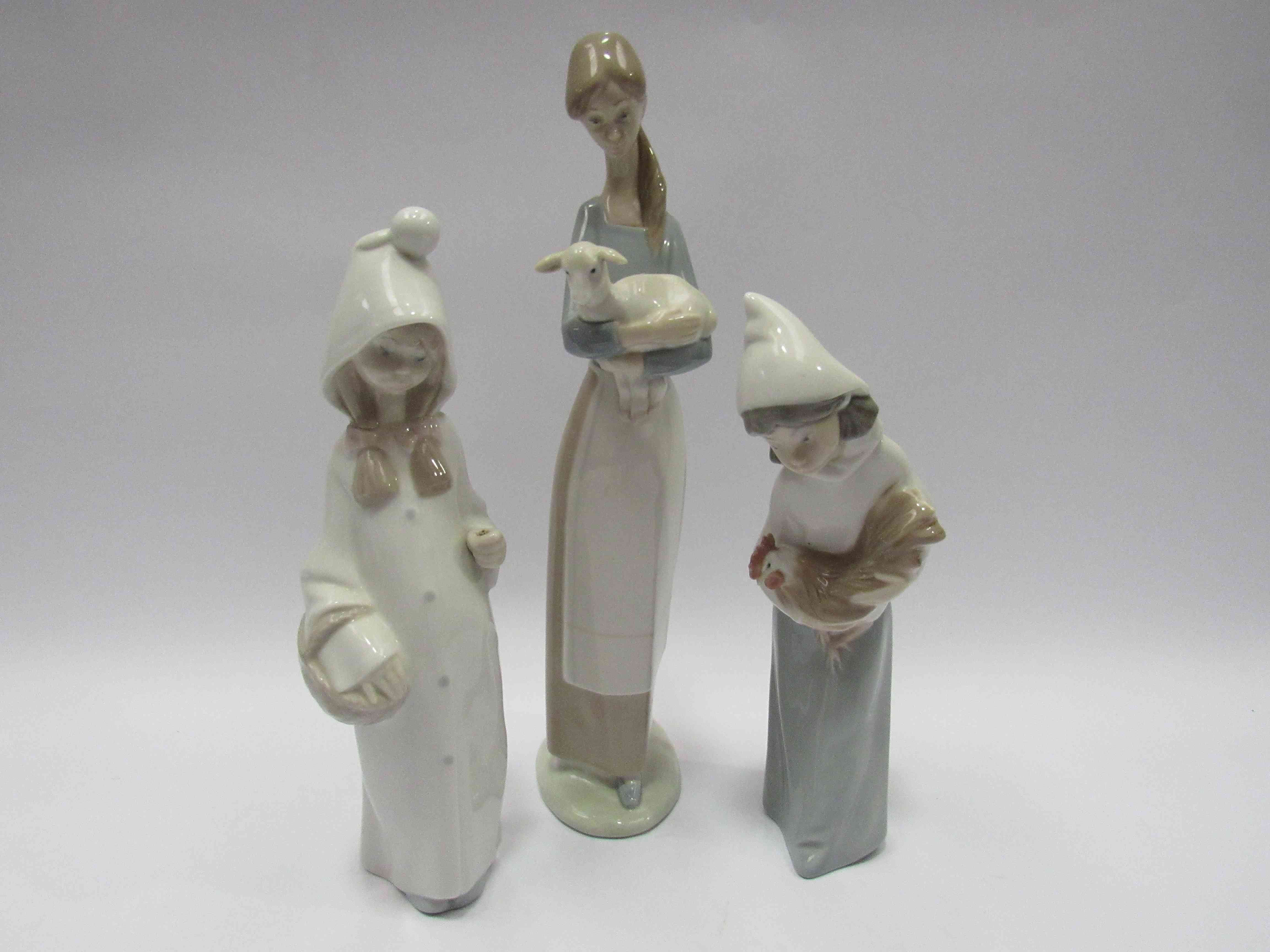 Three Lladro figures: Girl with lamb,