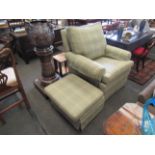 An armchair and footstool, green tartan upholstery,