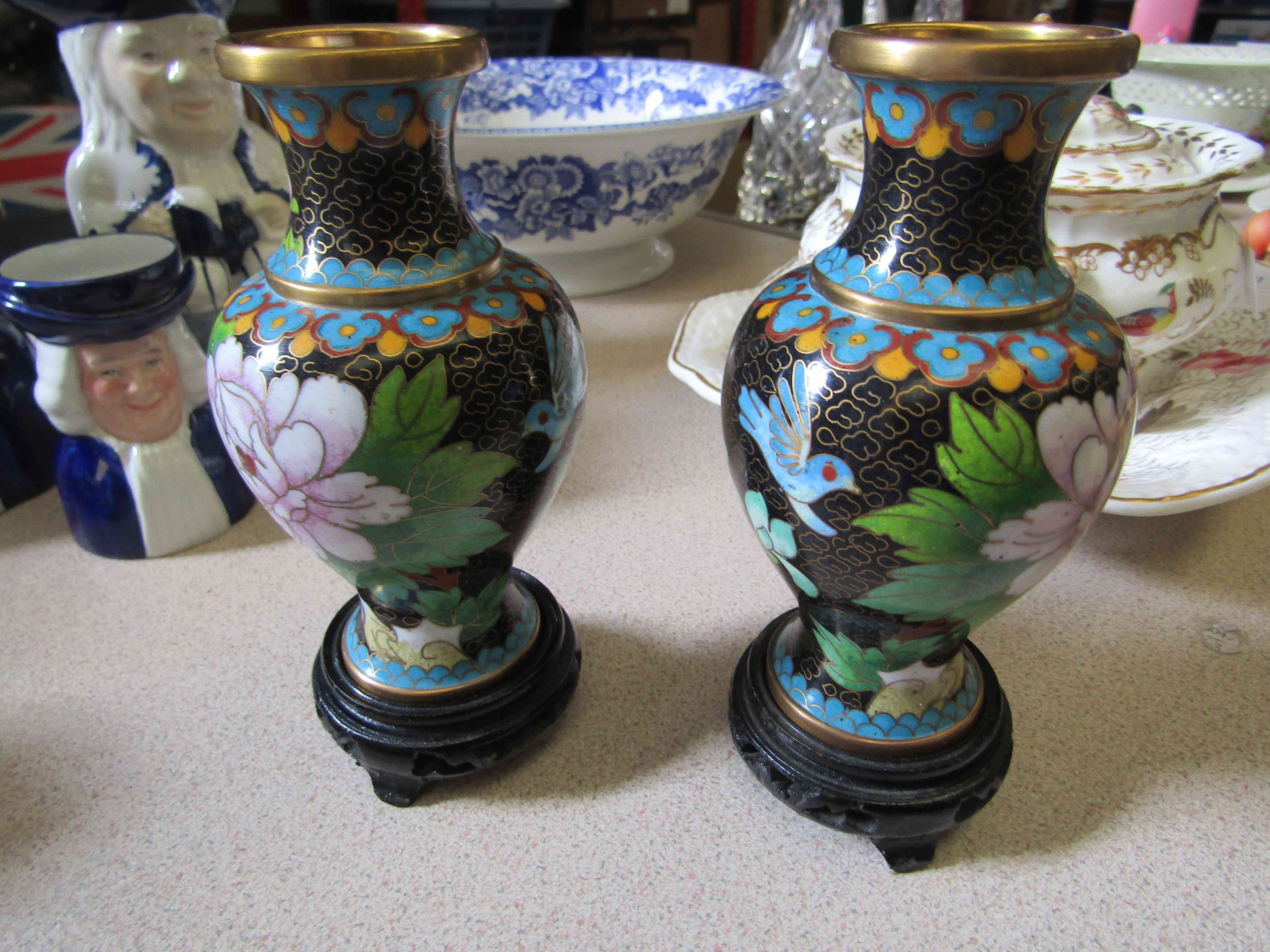 A pair of cloissoné bulbous body vases on stands,