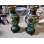 A pair of cloissoné bulbous body vases on stands,