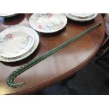 A Victorian coiled glass "candy cane" walking stick with crooked handle,