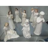 Eight Royal Doulton white ground figures including Christmas themed