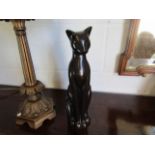 A stylised seated cat figure,