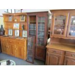 An early 20th Century oak astral glazed bookcase on two door cupboard base a/f,