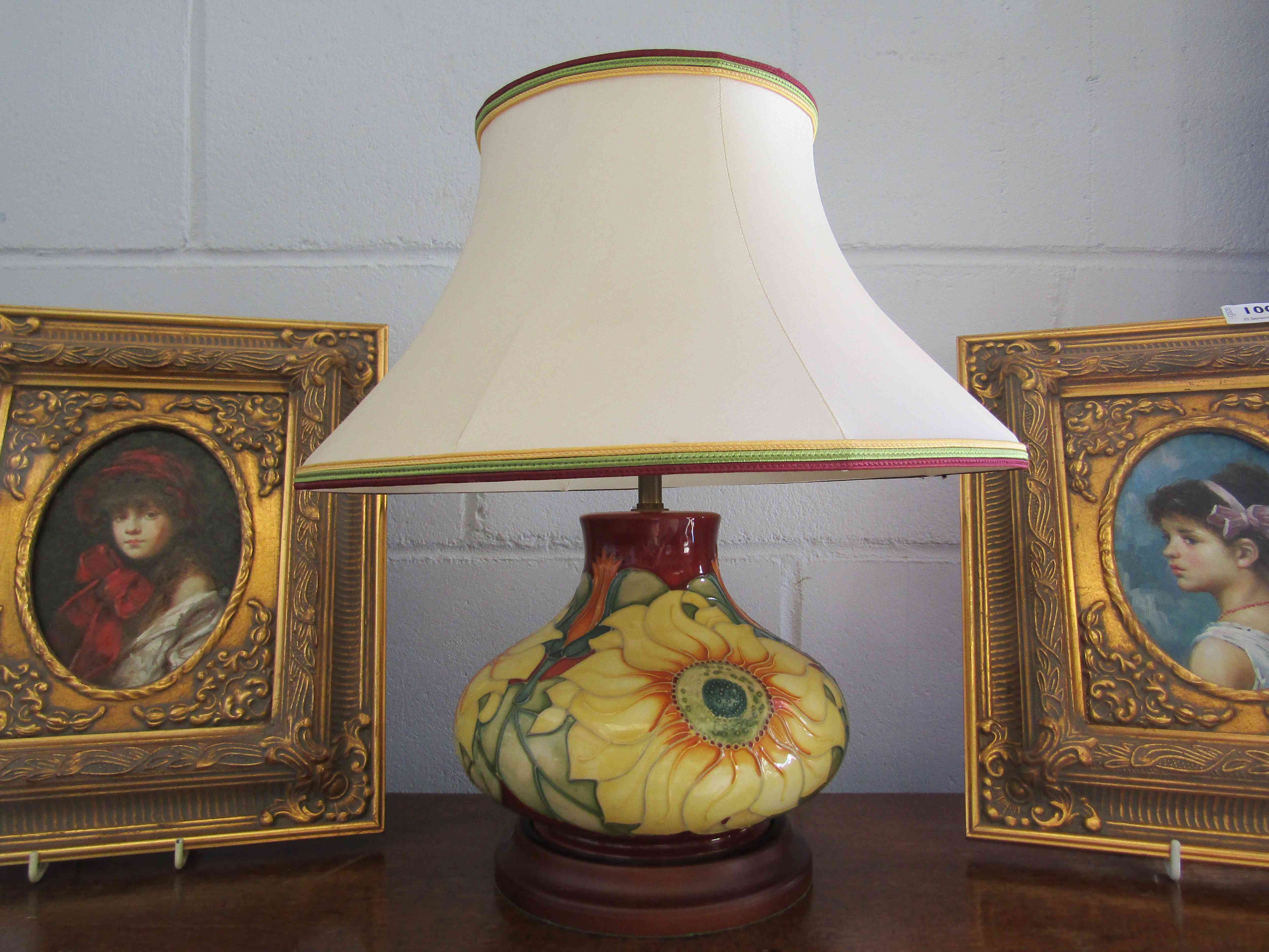 A Moorcroft table lamp with 'Sunflower' design on base and dated 13.5.