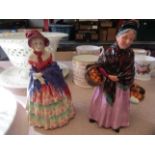 Two Royal Doulton figurines "The Orange Lady" and "A Victorian Lady",