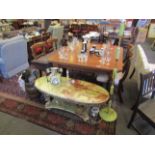 A two tier onyx coffee table with gilt fish design supports, an onyx table lamp base,