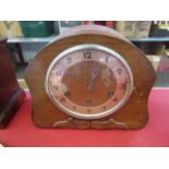 A 1930's oak cased mantel clock,