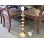 A turned brass table lamp base
