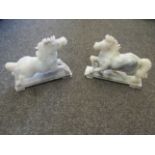 A pair of grey jade horses on stands, 14.