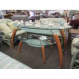 Two modern graduating glass top oval tables