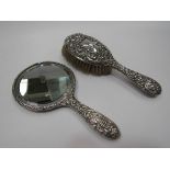 A silver backed hair brush and hand mirror,