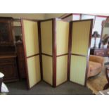 An Edwardian mahogany four fold screen with green fabric panels,