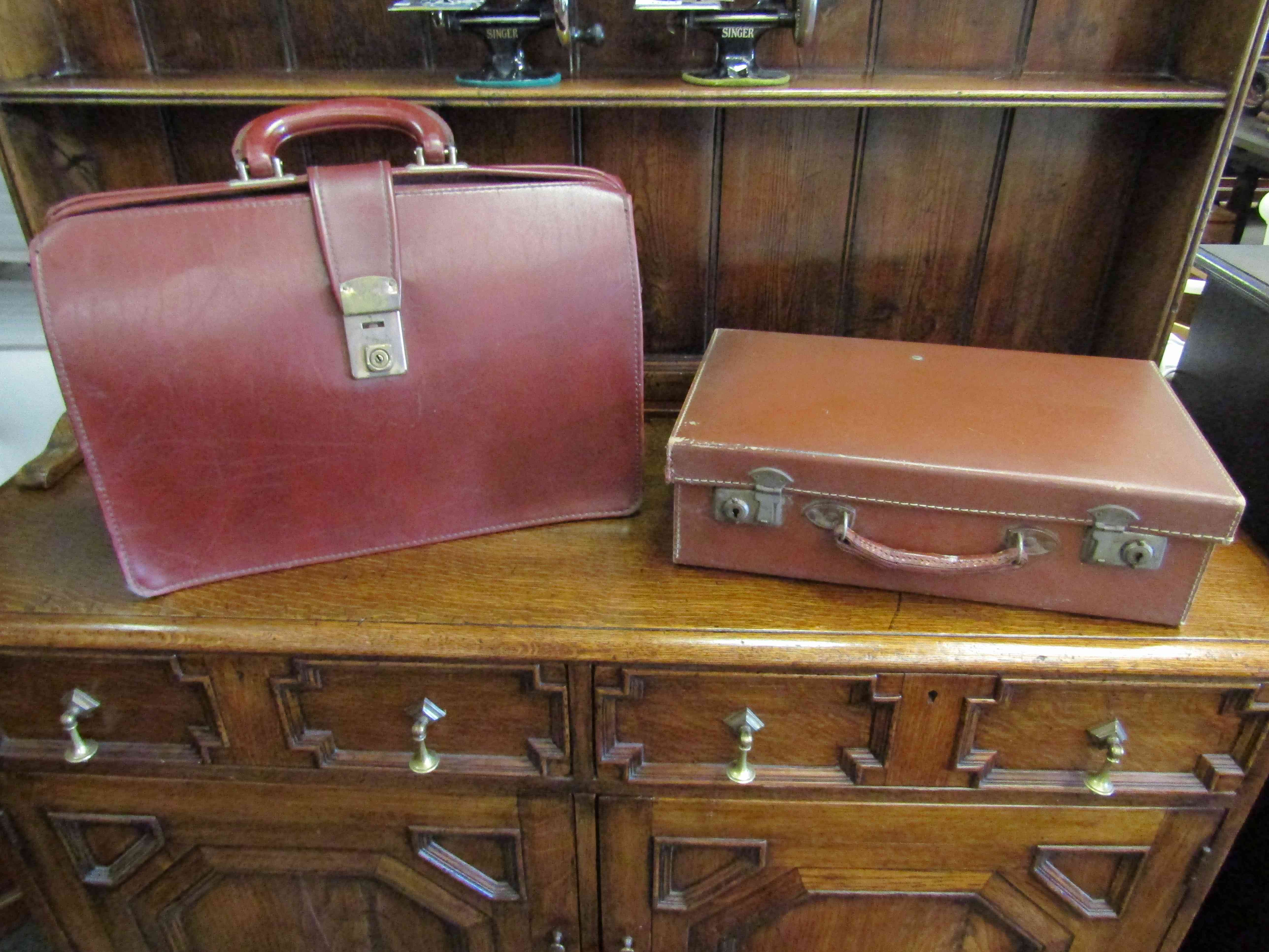A briefcase and another