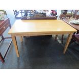 A modern beech rectangular kitchen table,