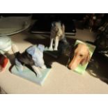 A pair of Denby dog bookends and another single bookend with dog's head (3)
