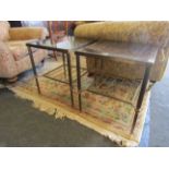 A pair of brass and glass two tier occasional tables on reeded legs