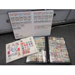Three albums of assorted stamps