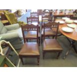 A set of six Victorian dark stained dining chairs with upholstered seats,