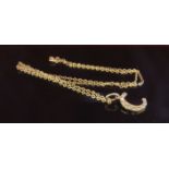 A 9ct gold chain, 45cm long hung with a diamond set "C" pendant, 2.