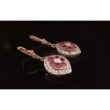 A pair of Ciaran O'Flynn gold and ruby diamond cluster drop earrings, stamped 375, 3.3cm long, 4.