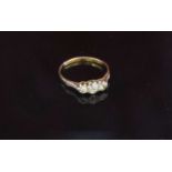 An 18ct gold platinum set three stone diamond ring .40ct total approx. Size Q/R, 2.