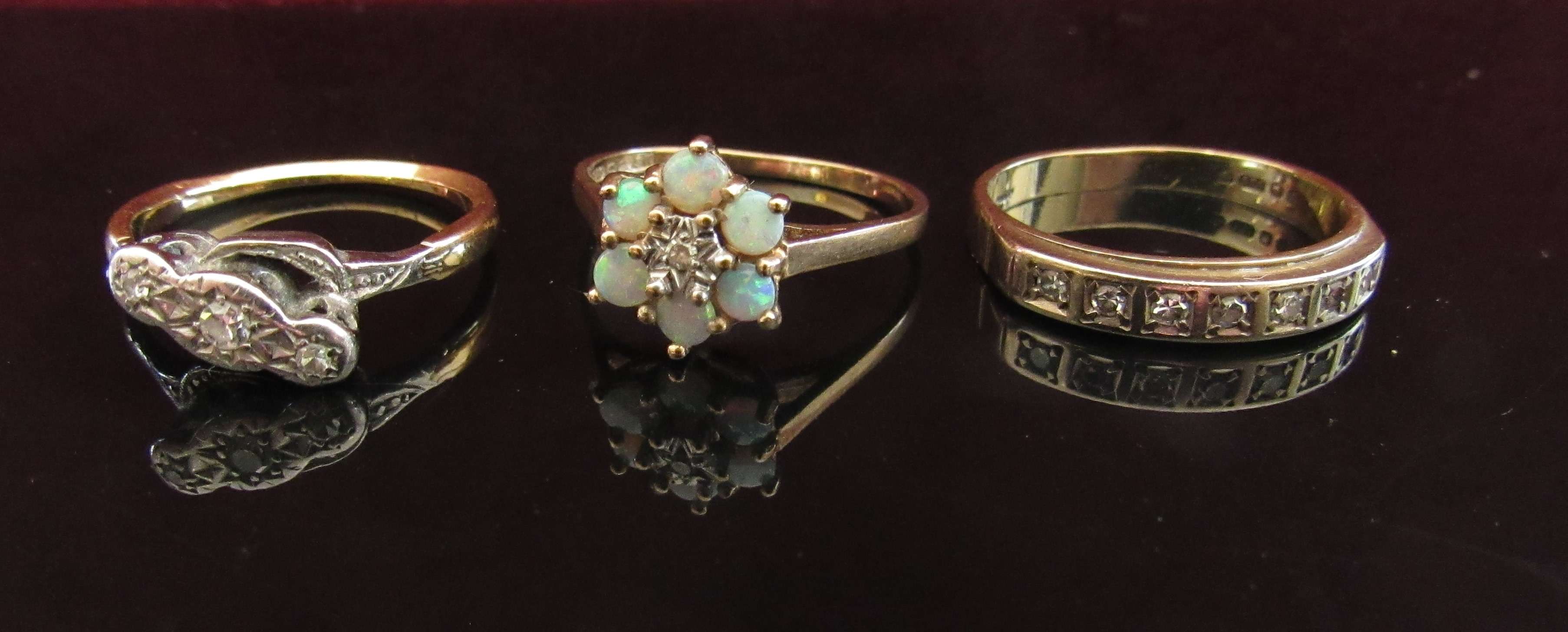 Two 9ct gold rings, one opal and diamond chip daisy ring, size K.