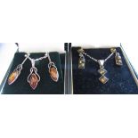 Two set of amber earrings with matching pendant necklaces,