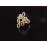 A 9ct gold fancy scroll ring. Size N, 4.