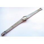 A 9ct white gold Longines lady's wristwatch, 33.