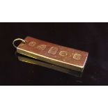 A 9ct gold ingot pendant, 28.