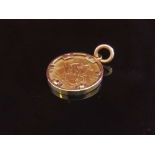 An 1887 half gold sovereign in pendant mount, 6.