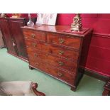 A George III flame mahogany chest of two short over three graduating long drawers on bracket feet,