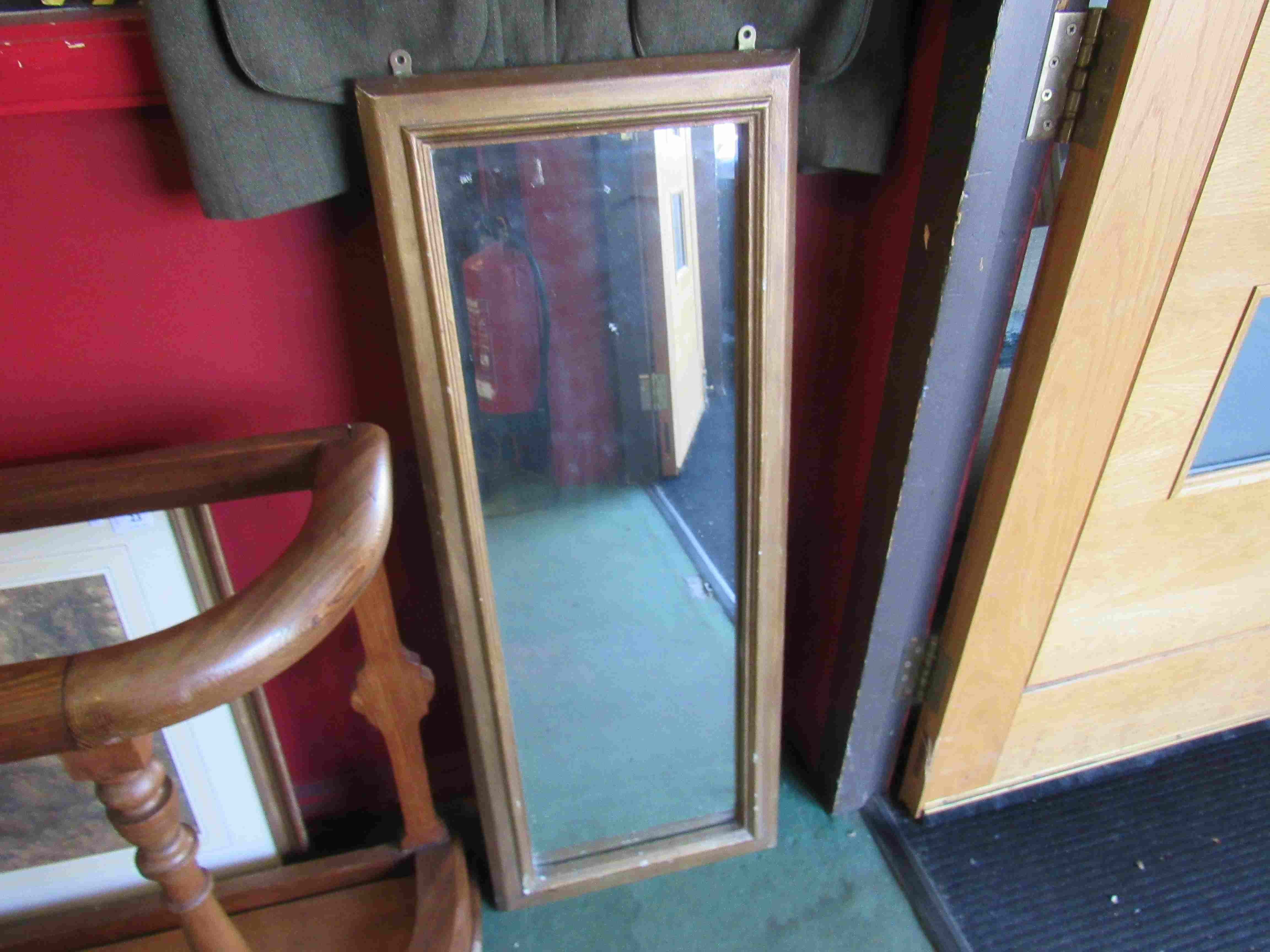 A gilt framed wall mirror,