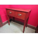 An 18th Century oak two drawer hall tab;e on square tapering legs,