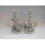 A Johanson Roth pair of porcelain candlesticks, figural cherub design with fish and birds, a/f,