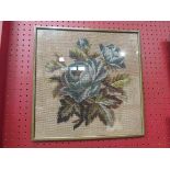 A beadwork picture of floral specimens,