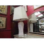 A terracotta Art Nouveau style urn shaped table lamp base with cream shade